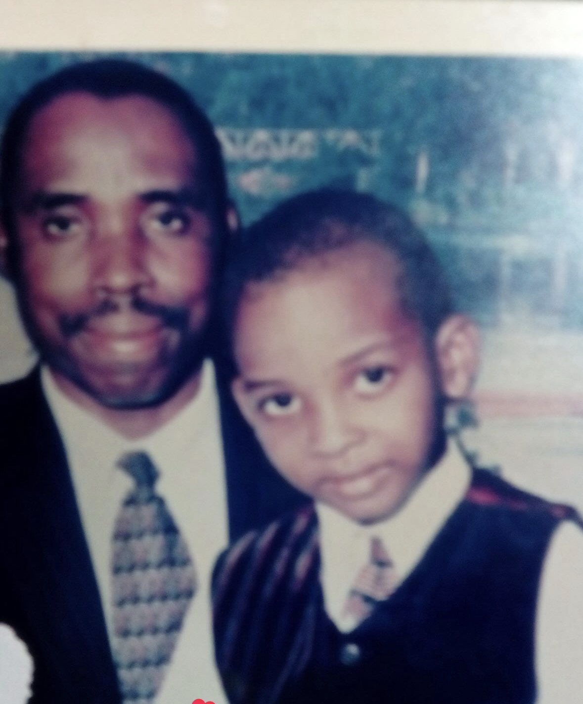 Emmanuel Pius-Ogiji as a child with his father